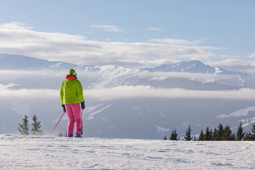 man and woman skiing and snowboarding in the mountains, ski resort